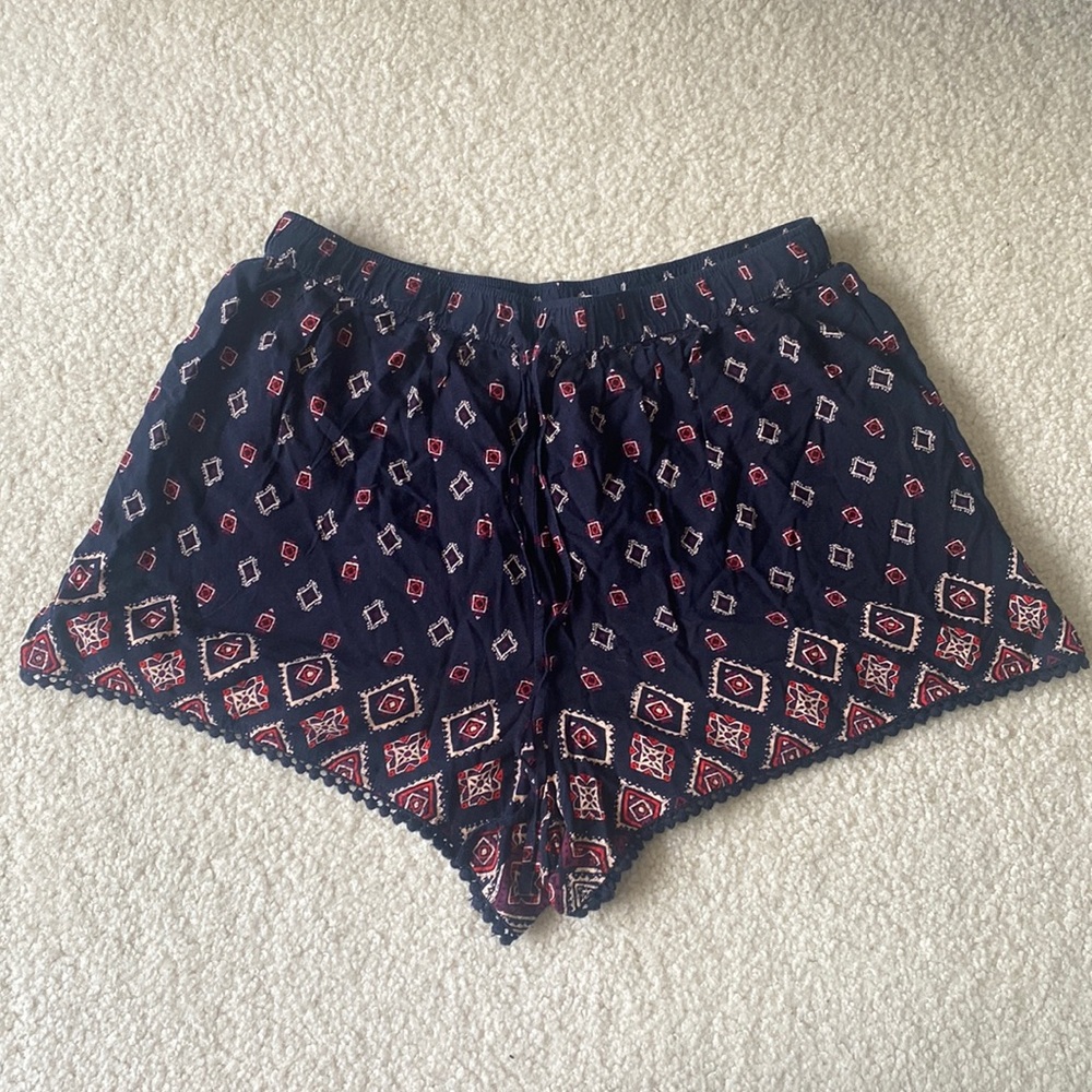 Blue flowy Hollister dress shorts with pink pattern detailing